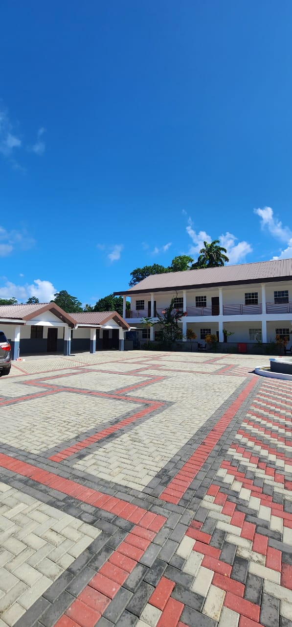 Olympic Villas paved courtyard and parking area