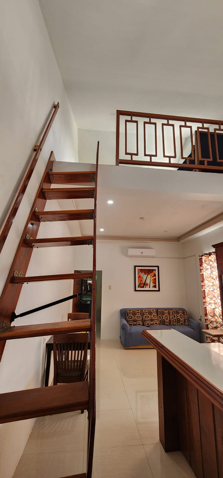 One-bedroom apartment living room and staircase